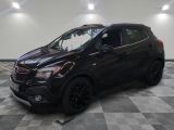 a black buick suv is parked in a garage