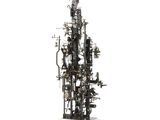 a sculpture of a tower made out of pipes and wires