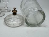 a glass jar with a wooden stopper on top of it