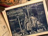 an old book with a picture of a church on it sitting on a table