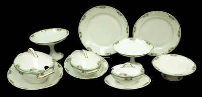 a lot of white plates and bowls on a table