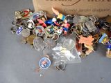 a box full of assorted keychains on a table