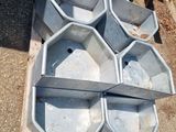a pile of cement bowls sitting on the ground