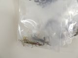 a lot of different types of fishing lures in a bag