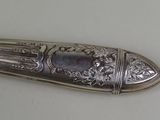 a silver spoon that is sitting on a table