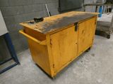 a yellow cabinet sitting in the middle of a room