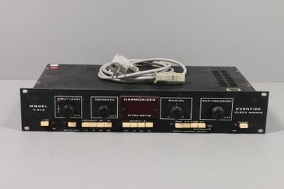 a close up of a radio receiver with wires on top of it