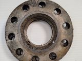 a metal ring with holes in it on a white surface