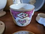 a cup that is sitting on a table next to a plate