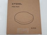 the packaging for the xtool filter pack is brown and has a black outline on it
