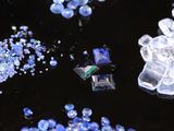 a lot of blue and white crystals on a black surface