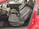 a red car with black seats in the back of it