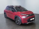 the red citrole is parked in a large room