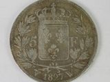 an old silver coin with a crown on top of it