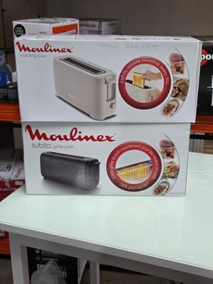 two boxes of food sit on top of a table in a store