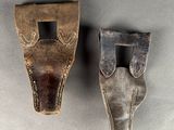 pair of leather holsters from the people ' s republic of south africa