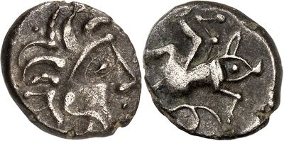 a silver coin with an image of a bird on it