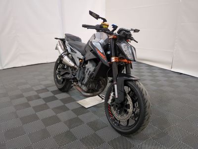 a motorcycle that is parked in a room with a checkered floor