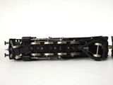 a black and gold train engine on a white surface