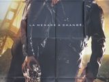 L'affiche du film « Terminator » est accrochée au mur.