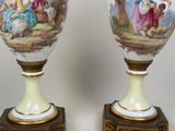 two vases that have been painted with a painting on them