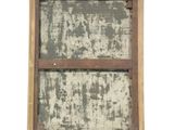 an old window with a wooden frame on the outside
