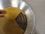 a person that is putting a piece of paper in a pan