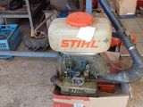 a small machine that is sitting in a garage
