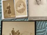 several old black and white photos of people sitting on a bed