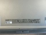 a laptop that has a sticker on the back of it