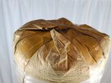 a roll of fabric wrapped around a wooden table