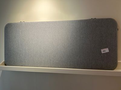 a large speaker sitting on a shelf in a room