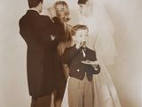 a vintage photo of a man and a woman and a young boy