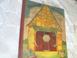 a picture of a book with a picture of a barn on it