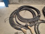 a lot of hoses that are laying on the floor
