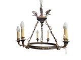 an image of a chandelier with three candles and a bird on it