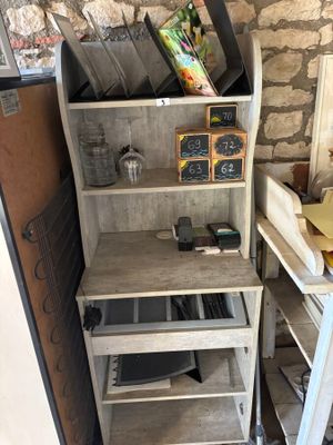 a shelf that has a bunch of items on it