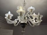a chandelier that is hanging from the ceiling in the room