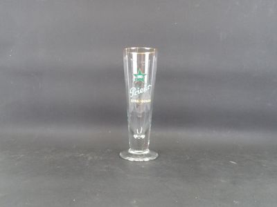 a tall glass with a green star on it