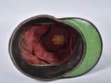 a green and black hat with a red lining on it