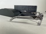 a pair of glasses sitting on a table next to a pair of glasses