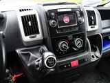 a dashboard of a car with a radio and a steering wheel
