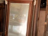 a large mirror sitting on the floor in a room