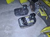 two power tools that are sitting on the floor
