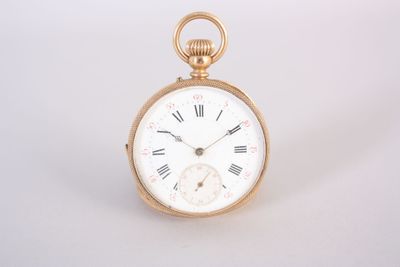 a gold pocket watch with roman numerals on the face