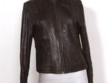 the mannequin is wearing a brown leather jacket on a white mannequin