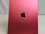 a close up of the back of an apple ipad with a red cover