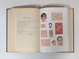 an open book with a picture of a man ' s face on it