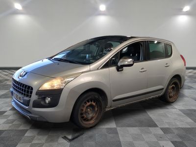 a picture of a silver car parked in a garage