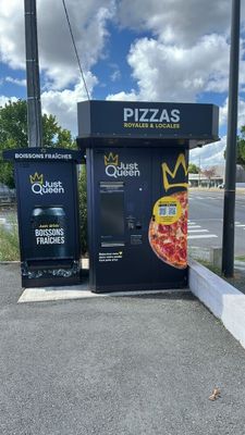 two vending machines on the side of the road